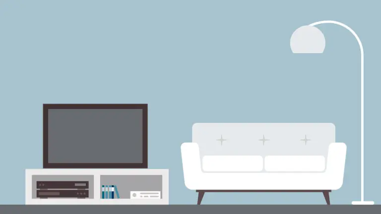 Wohnzimmer mit TV-Kommode, Couch und einer Lampe